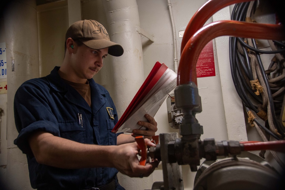 U.S. Navy Sailor Checks Emergency Steering