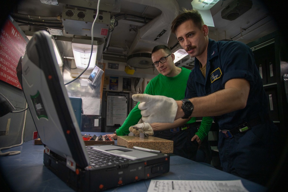 U.S. Navy Sailors Calibrate A Caliper