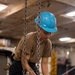 U.S. Navy Sailor Prepares To Hoist A Transmitter