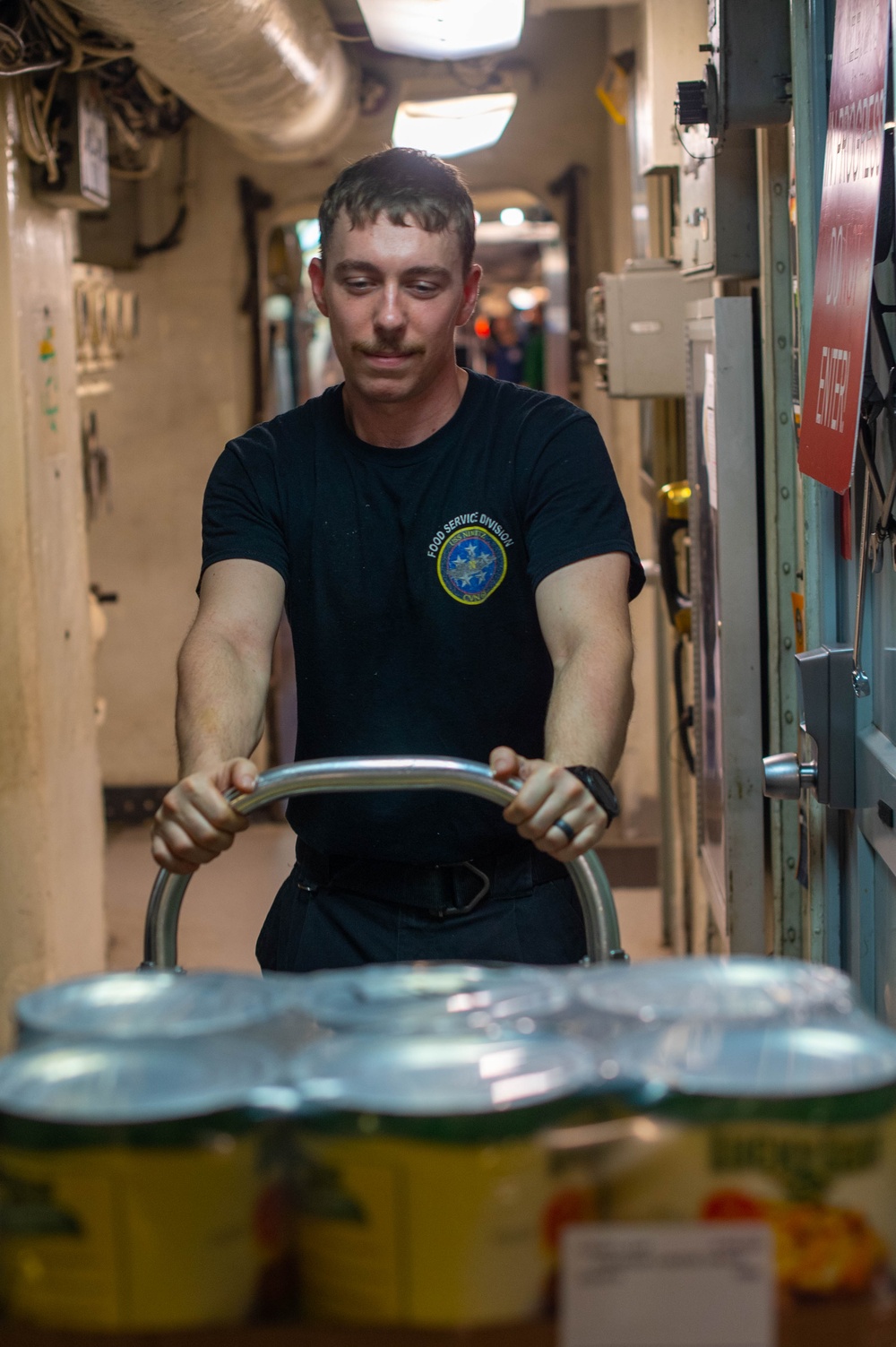 U.S. Navy Sailor Transports Food