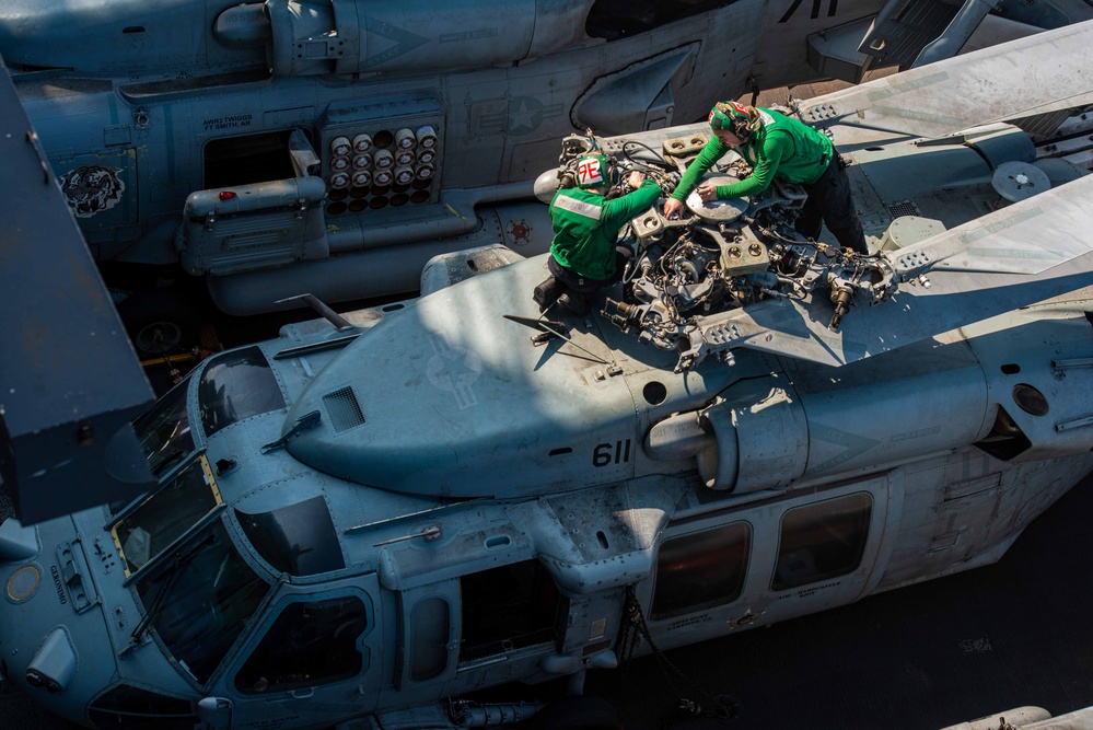 Sailors Perform Maintenance On Helicopter