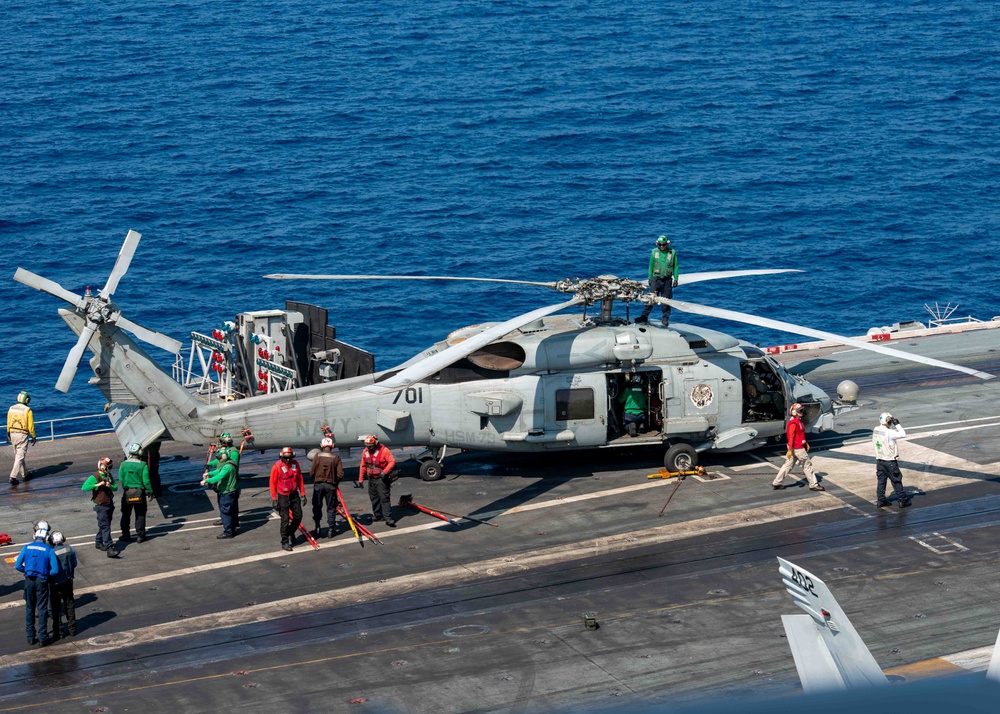 Sailors Prepare Helicopter For Transport