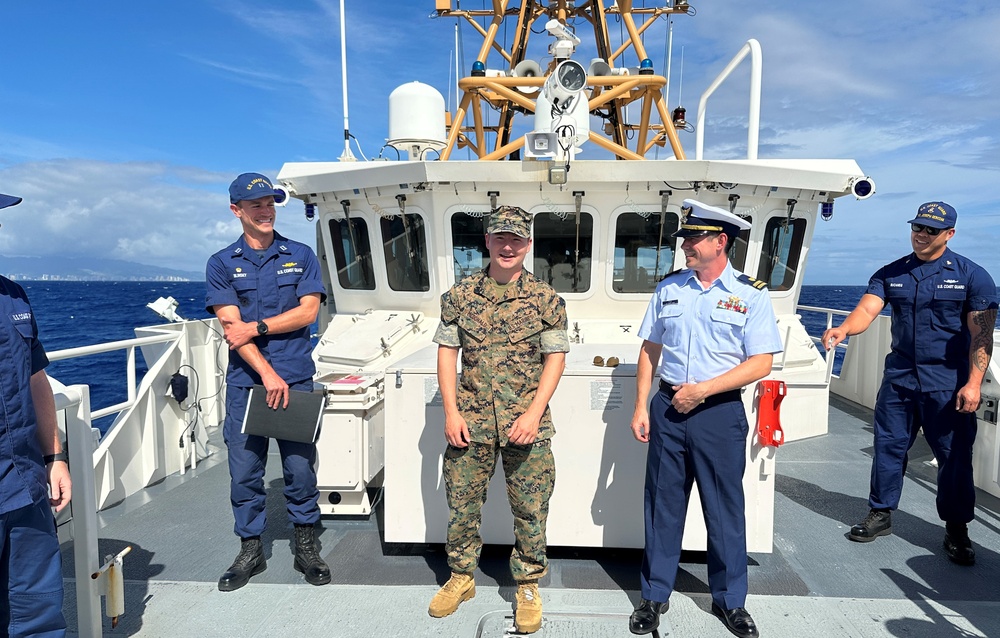 U.S. Marine departs U.S. Coast Guard Cutter Joseph Gerczak