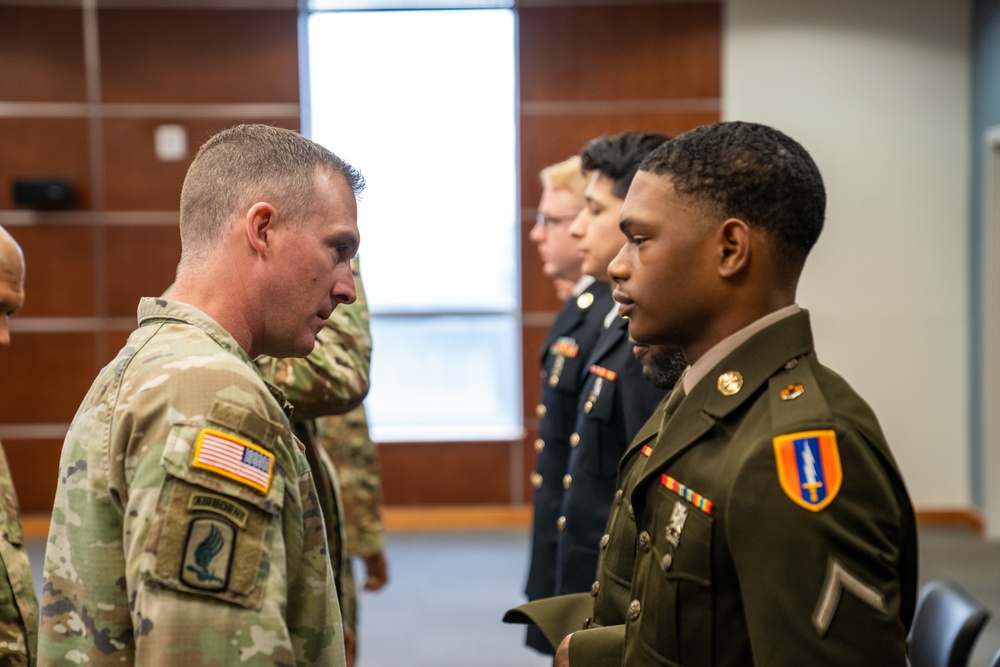 Soldiers from the Best Signal Squad competition go to the board.