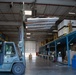 Aerial Port Airmen move equipment with forklift