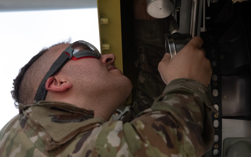 Airmen inspect MC-130J Commando II refueling pod