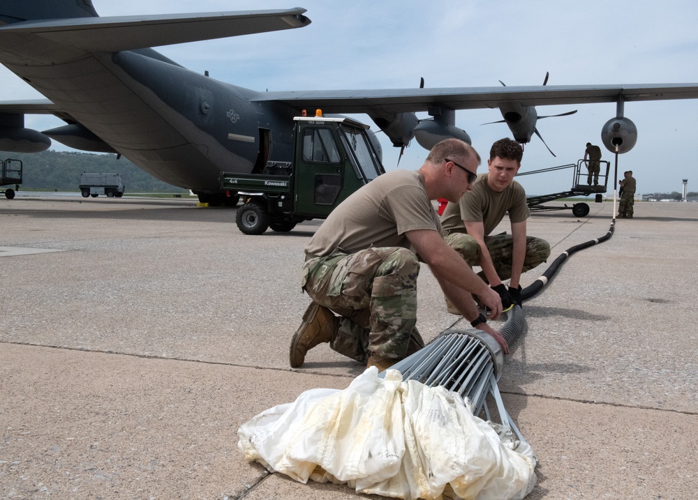 Airmen inspect MC-130J Commando II refueling pod