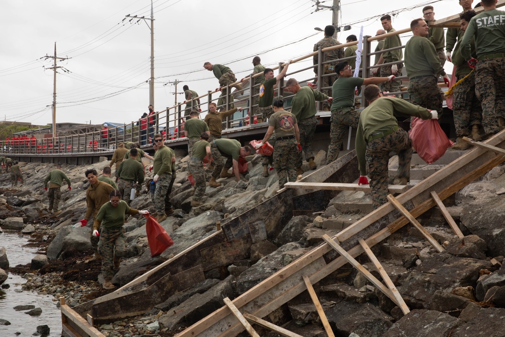 HQ Bn. Marines clean the beach