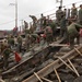 HQ Bn. Marines clean the beach