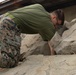 HQ Bn. Marines clean the beach