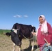 A Cooperative Member of the USAID-Supported SMSA Al Amaal Cooperate in Kairouan, Tunisia, Poses with a Cow