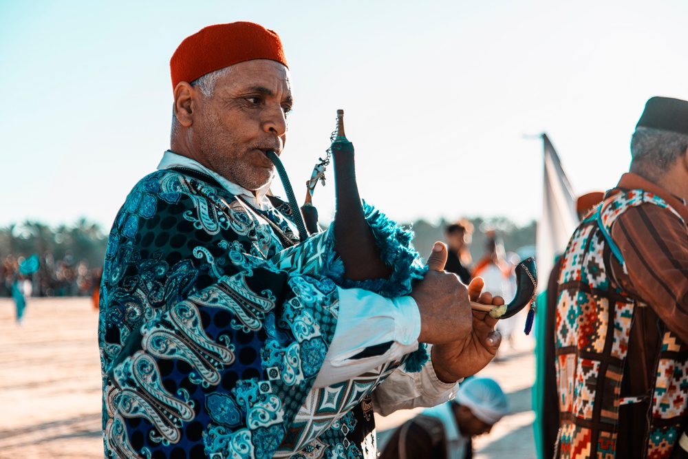 A Man Plays an Instrument as part of the Tozeur International Oases Festival in Tozeur, Tunisia – One of Six Tunisian Festivals to Partake in a USAID Program