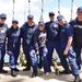 USCGC Eagle personnel, all with connections to the USCGC Mackinaw, pose for a group photo while underway in the Atlantic Ocean