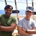 Foreign military personnel aboard USCGC Eagle pose for a photo in the Atlantic Ocean