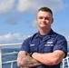 Coast Guard officer candidate poses for a photo aboard USCGC Eagle in the Atlantic Ocean