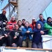 Mariners with Tall Ships America pose for a group photo aboard USCGC Eagle in the Atlantic Ocean