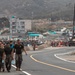 US Marines, Republic of Korea Marines and Sailors, and local community volunteers help clean the earth