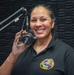 Cmdr. Elyse Braxton poses for a photo in the AFN Bahrain Studio