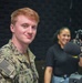 MC2 Alec Kramer poses for a photo in the AFN Bahrain Studio