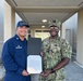 U.S. Coast Guard awards letter of commendation to U.S. Navy corpsman