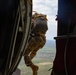 Special Tactics Airmen jump from a Marine Corps KC-130J Hercules