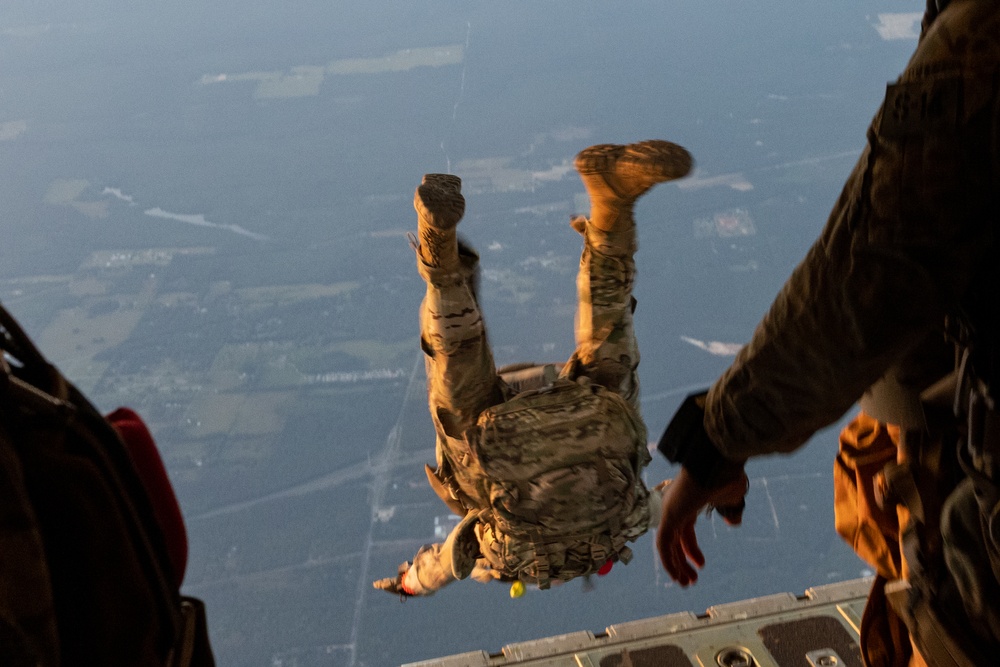 Special Tactics Airmen jump from a Marine Corps KC-130J Hercules