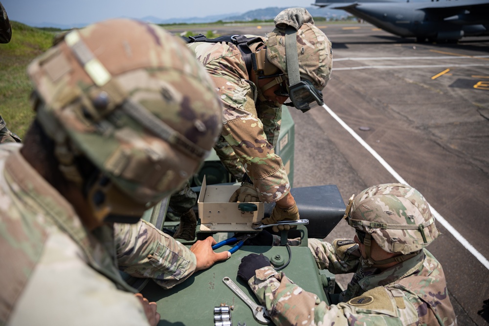 Balikatan 23 | U.S. Army Soldiers, Airmen Work Together to Load HIMARS