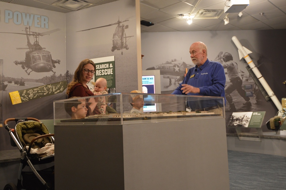 Museum volunteer engages with visitors