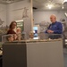 Museum volunteer engages with visitors