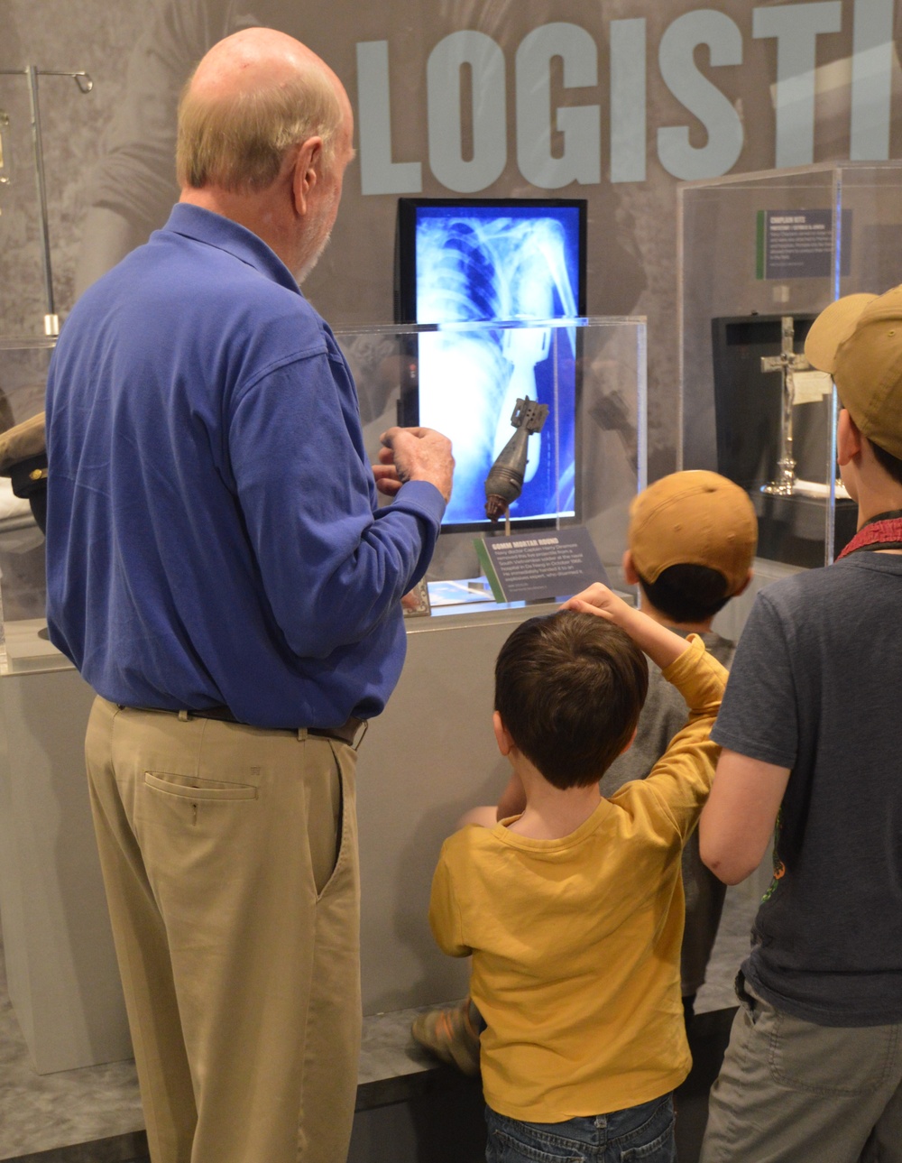 Museum volunteer engages with visitors