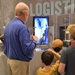 Museum volunteer engages with visitors