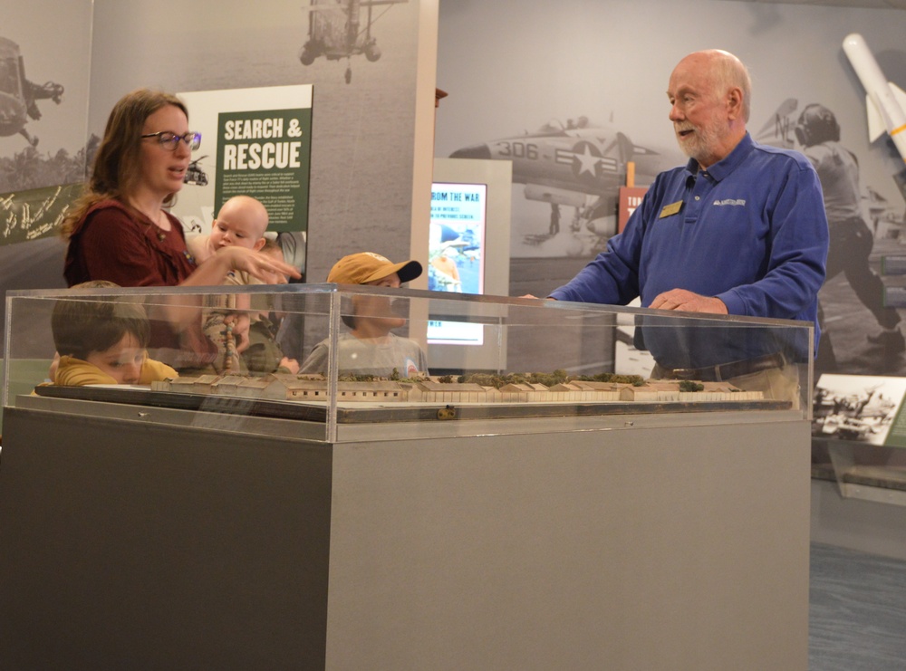 Museum volunteer engages with visitors