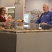 Museum volunteer engages with visitors