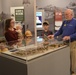 Museum volunteer docent engages with visitors