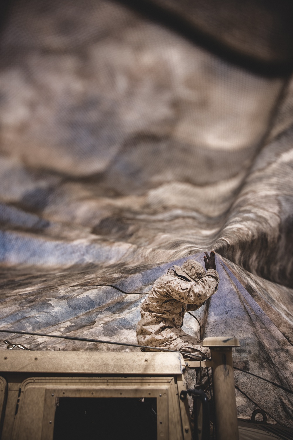 U.S. Marines with Combat Logistics Battalion 24 Practice Camouflage Techniques