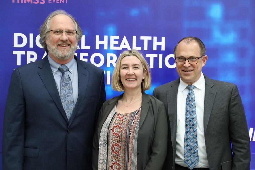 Dr. Brian Lein, Holly Joers, and Bill Tinston at HIMSS Conference