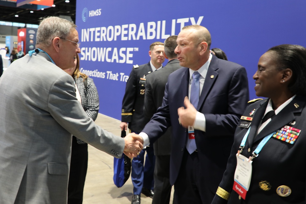 Dr. Lester Martinez-Lopez Greets Pat Flanders at HIMSS Conference