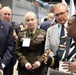 Lt. Gen. Crosland, Brig. Gen. Simonson, and Pat Flanders tour the Federal Health Pavilion at the HIMSS Conference