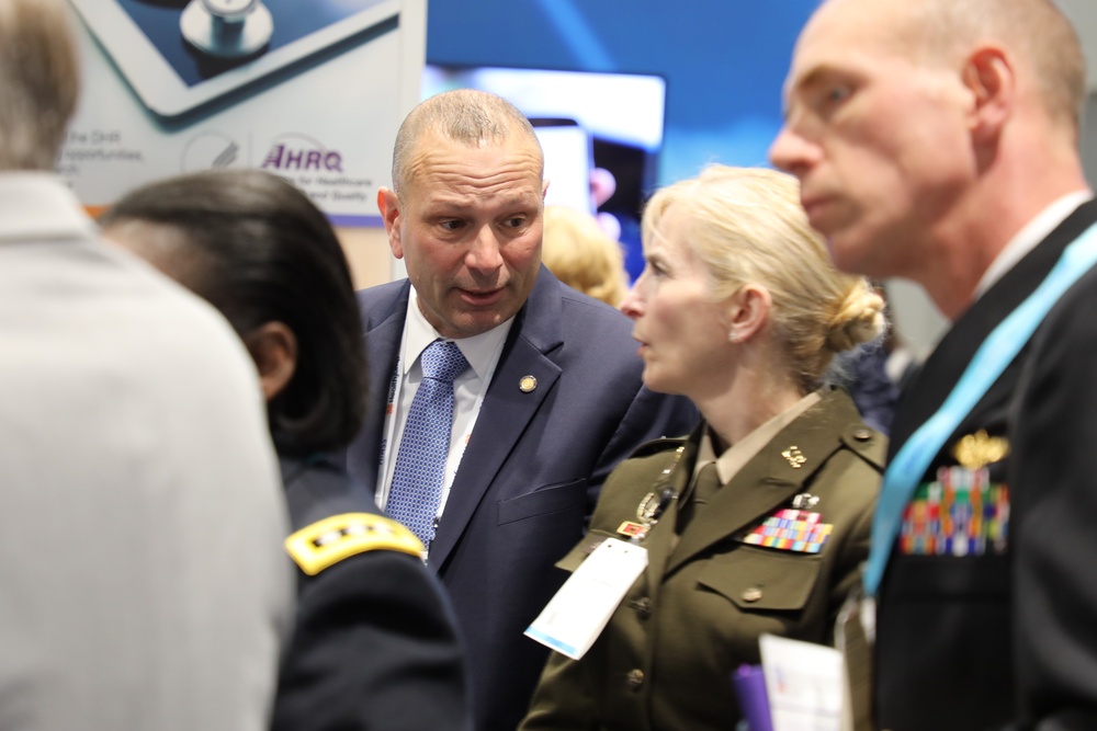 Brig. Gen. Simonson and Pat Flanders tour the Federal Health Pavilion at the HIMSS Conference