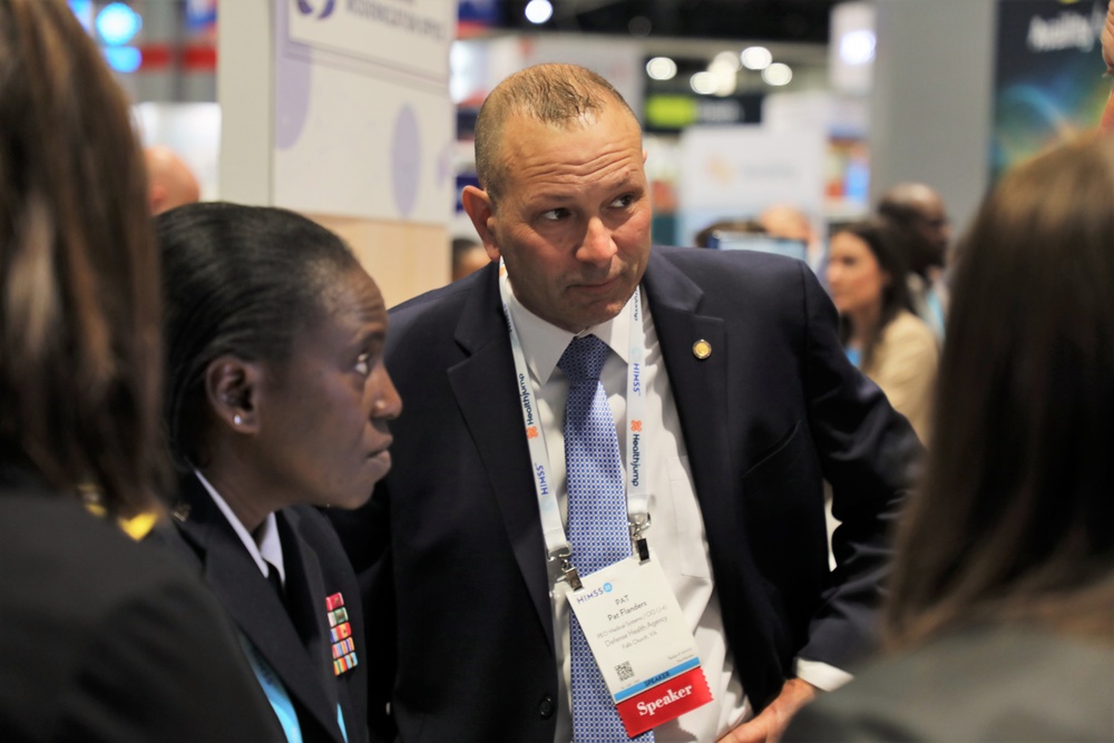 Lt. Gen. Telita Crosland and Pat Flanders tour the Federal Health Pavilion at the HIMSS Conference