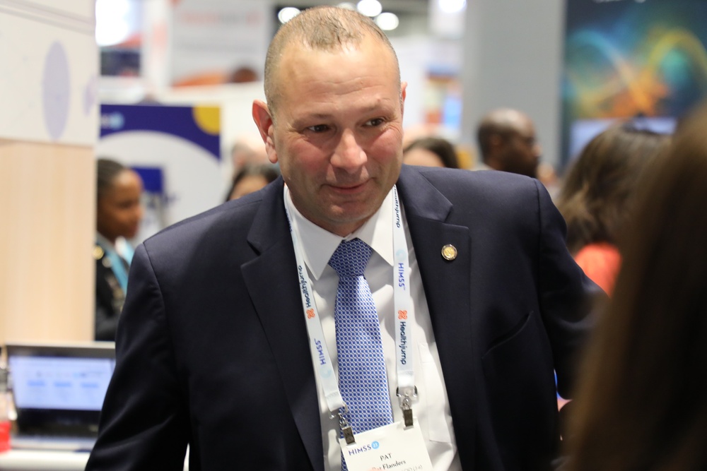 Pat Flanders tours the Federal Health Pavilion at the HIMSS conference