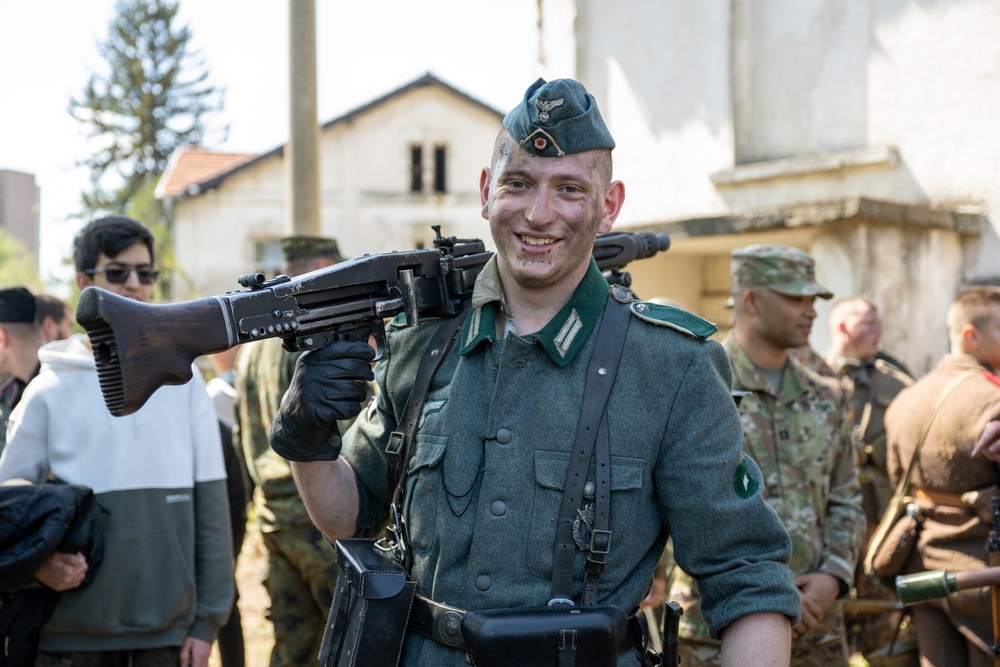 A Bulgarian volunteer carries weapon after WWII reenactment