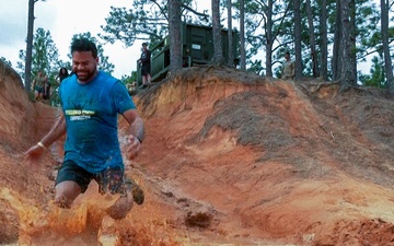 Elated runners take on a 4-mile trail of muck