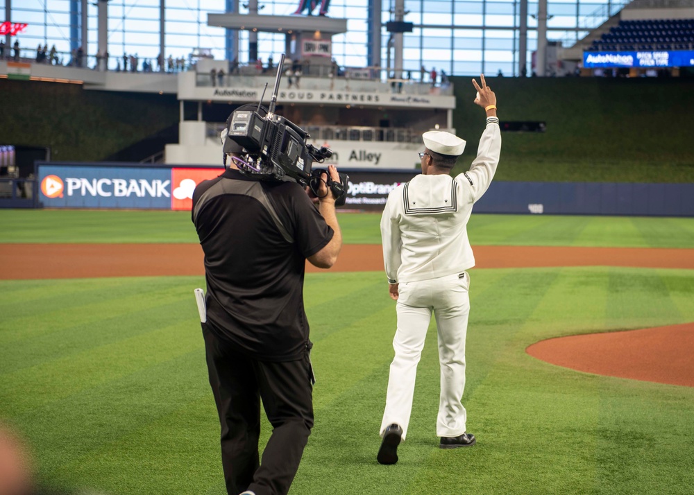 MIAMI, Fla. (May 2, 2022) - U.S. Navy Sailors parade the colors at a Miami  Marlins Major League Baseball game during Fleet Week Port Everglades  festivities, May. 2, 2022. Fleet Weeks are