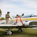 Iowa Chinook crew attach straps to F-80 Shooting Star for sling load