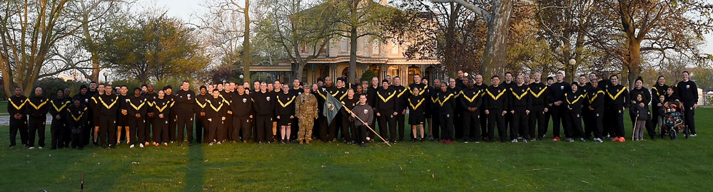 Runners and walkers pose for a group photo during the SHARP 5K