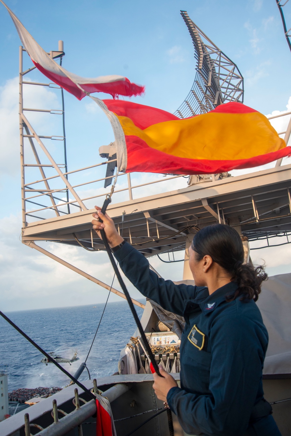 Sailor Raises Signal Flags