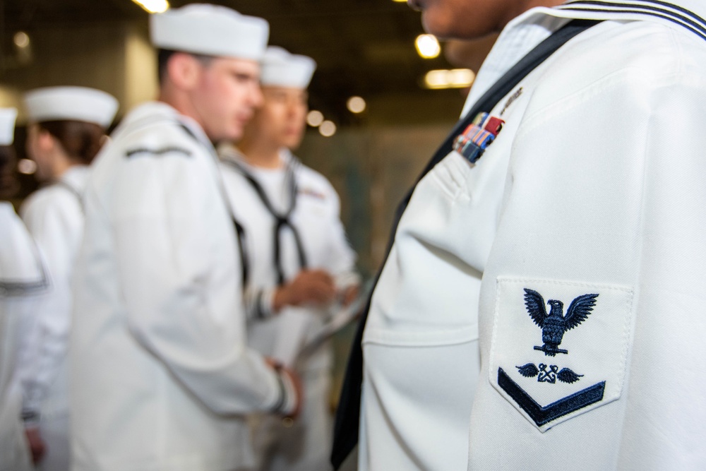 USS Ronald Reagan (CVN 76) Sailors conduct dress whites uniform inspection