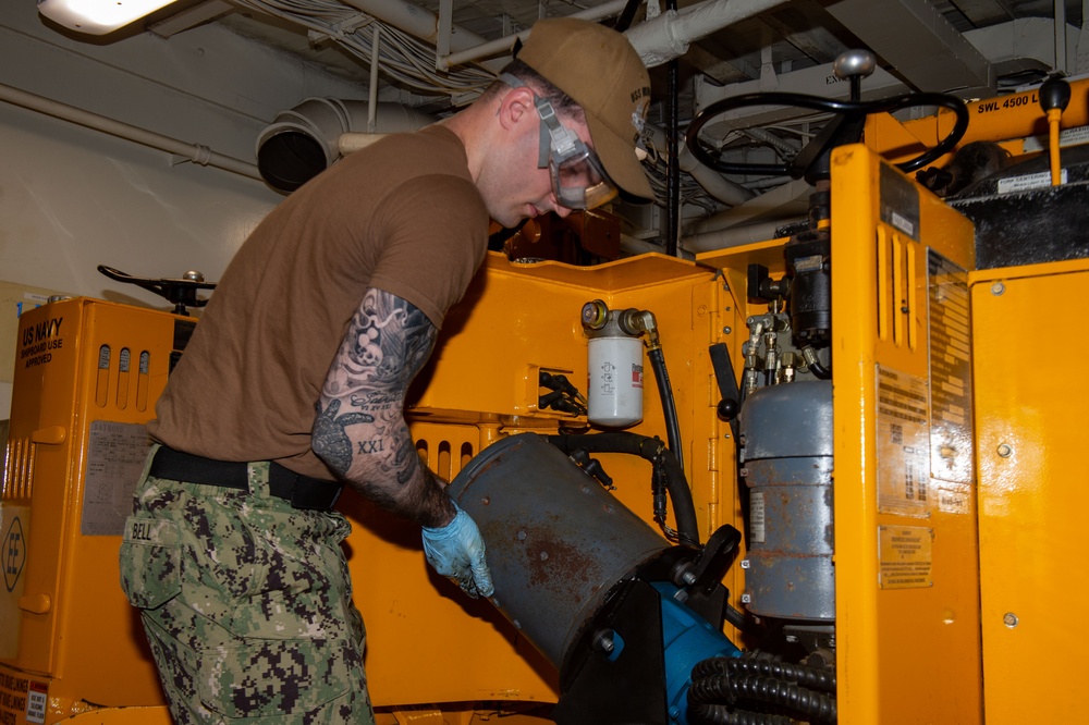 USS Ronald Reagan (CVN 76) Sailors perform maintenance on fire suppression systems