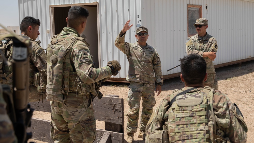 Platoon sergeant gives direction to squad